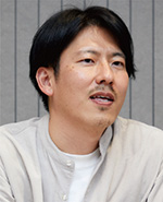 間宮 賢治 氏